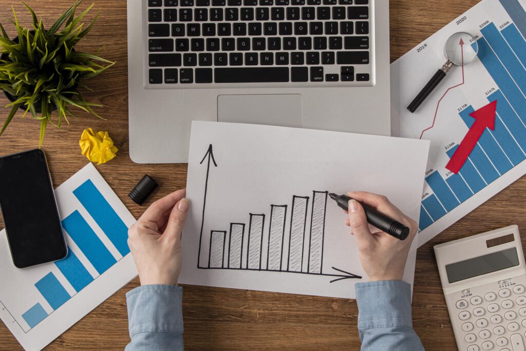 top view office desk with calculator growth chart 1